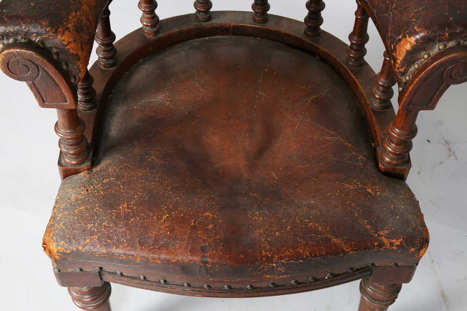 A late Victorian oak framed tub back desk chair, upholstered in brown leather, height 74cm, width - Image 6 of 11