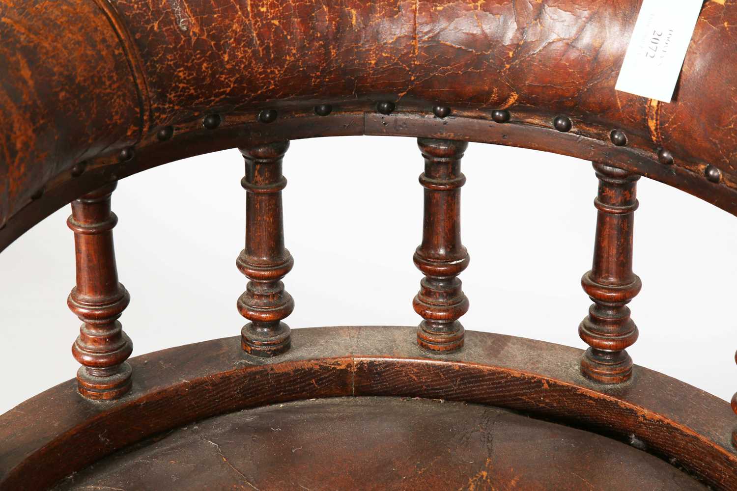 A late Victorian oak framed tub back desk chair, upholstered in brown leather, height 74cm, width - Image 4 of 11