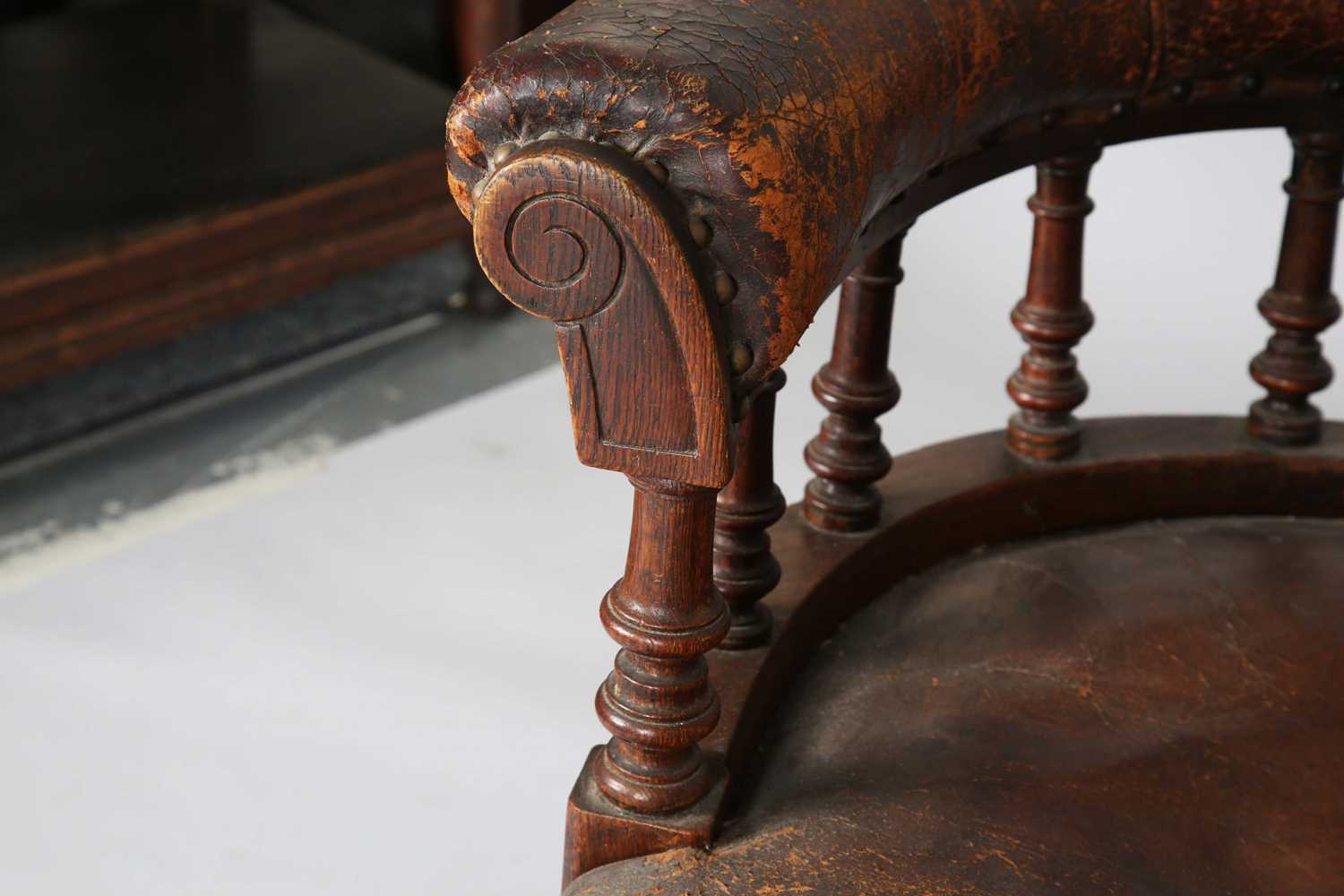 A late Victorian oak framed tub back desk chair, upholstered in brown leather, height 74cm, width - Image 5 of 11