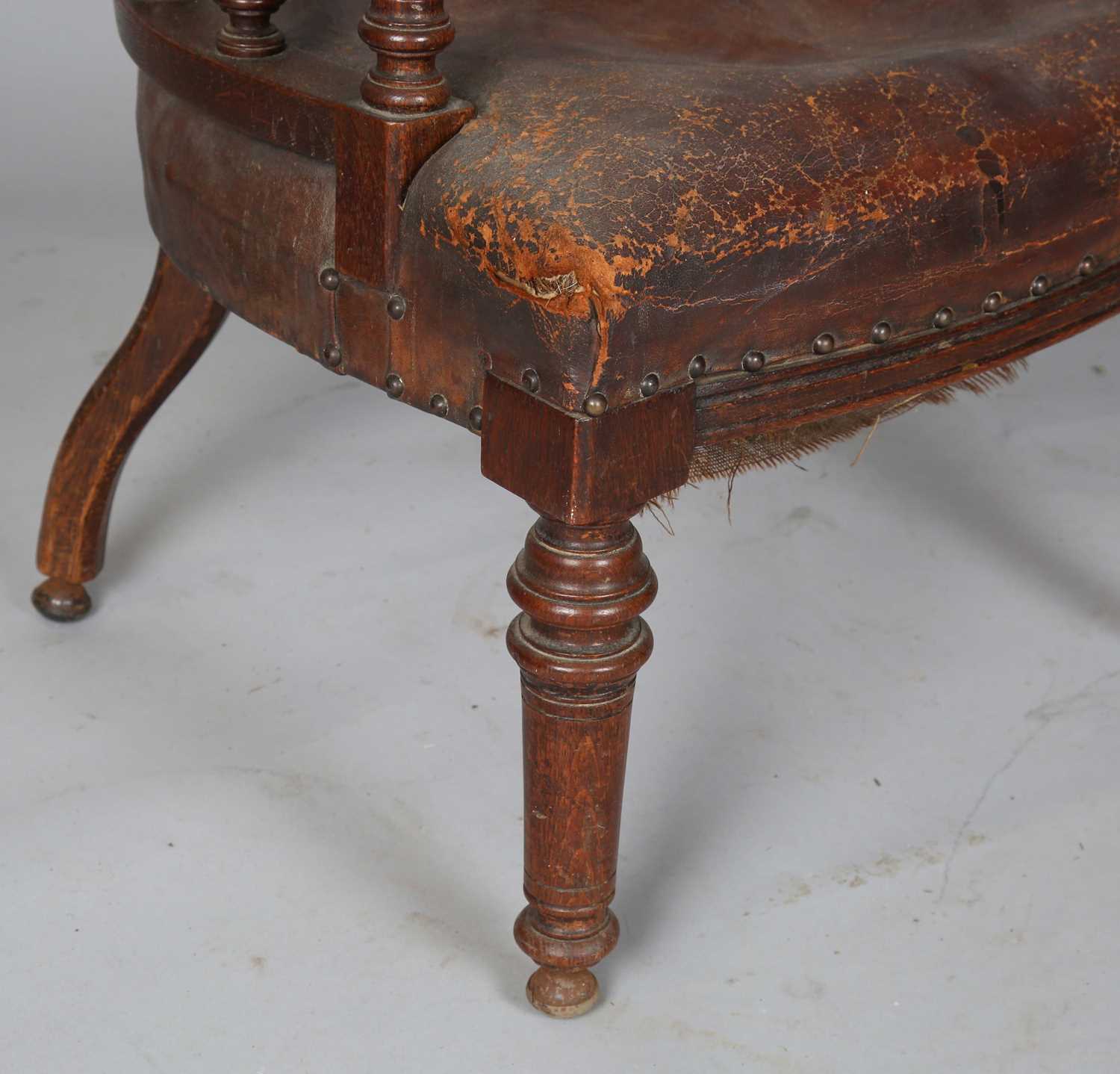 A late Victorian oak framed tub back desk chair, upholstered in brown leather, height 74cm, width - Image 7 of 11