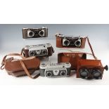A collection of assorted cameras and lenses, including a Zeiss Ikon Ikonta 521/16 camera, leather