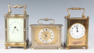 A Swiza silvered brass cased bedside alarm clock with signed gilt dial, height 10.3cm, together with