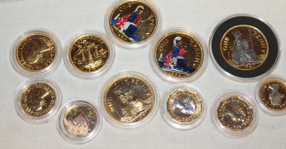 A selection of gold-plated bronze commemorative coinage 