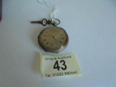 A Victorian silver cased fob watch with key.