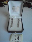 A pair of 18ct white gold dangley earrings. 5.59 grams.