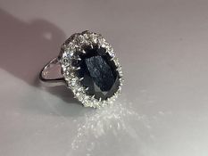 A white gold sapphire and diamond ring, size P half, 6.26 grams.