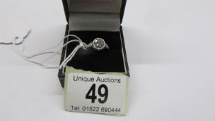 A platinum and diamond ring size L, 3.67 grams.