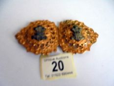 A gilt military buckle.