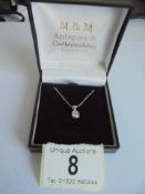 A 9ct gold chain with quarter carat solitaire diamond pendant, 1.95 grams.