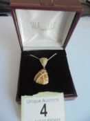 A 9ct gold double diamond pendant on a 9ct chain, 3.99 grams