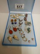 Eleven pairs of assorted earrings.