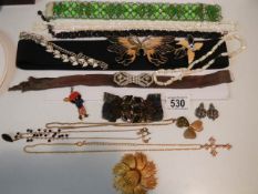 A mixed lot of costume jewellery, belts etc.,