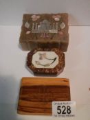 An alabaster box, an inlaid box and one other.