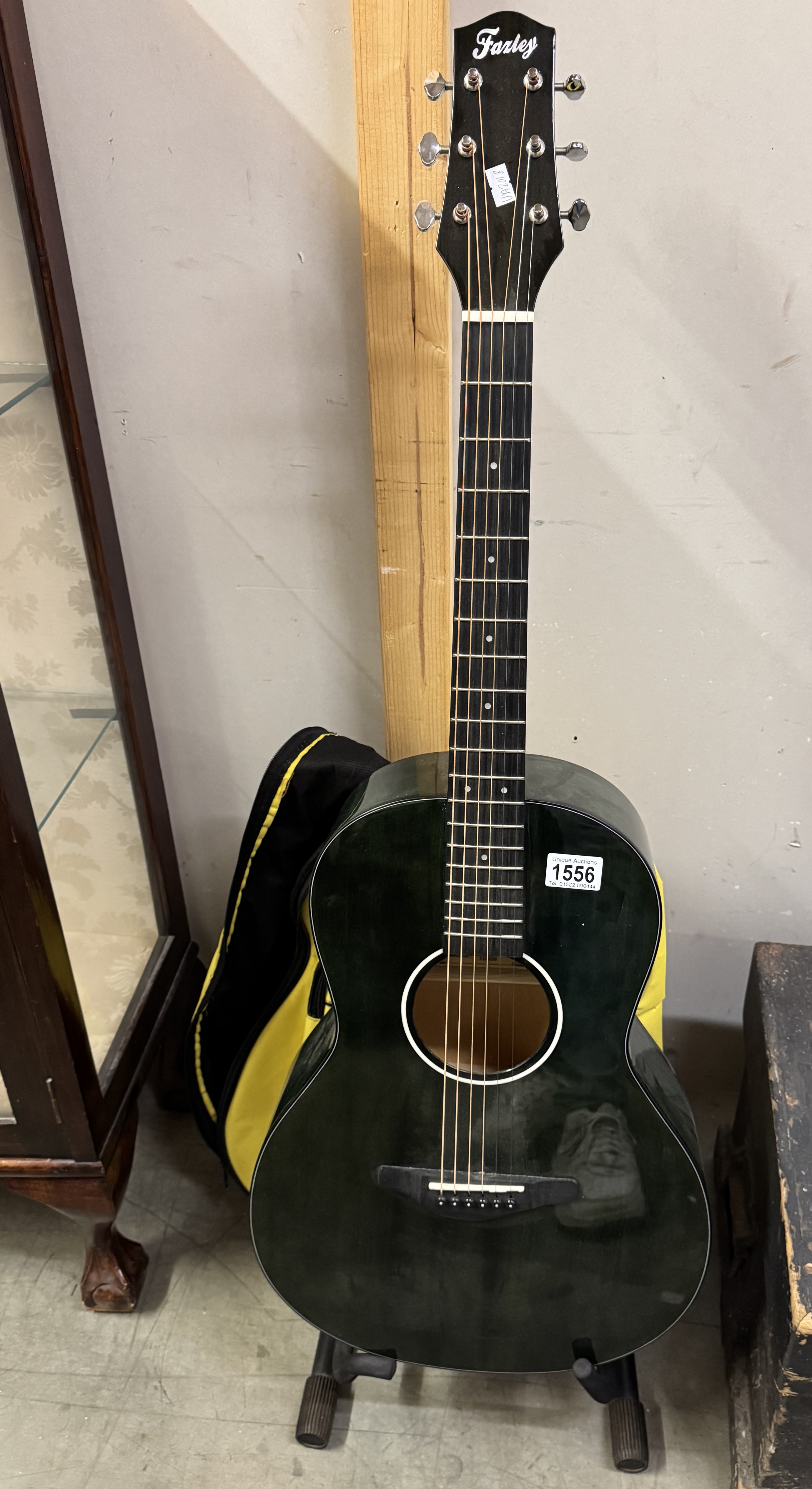 A Farley acoustic guitar with soft case.