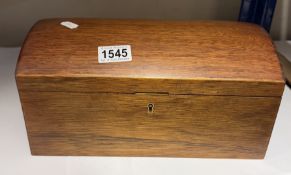 A mahogany dome top trinket / jewellery box