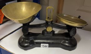 A cast iron scales with brass pans (no weights)