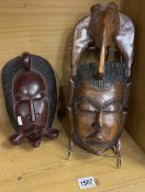 2 carved wood tribal masks