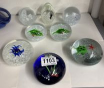 A quantity of paperweights with animals / sea life