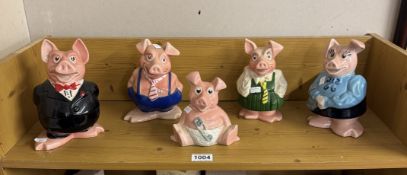 A quantity of Wade Nat West pig money boxes