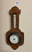 An Edwardian inlaid aneroid barometer