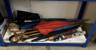 A quantity of umbrellas & walking sticks