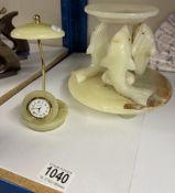 A marble dolphin tea light stand and a decorative marble clock