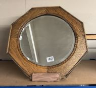 A wood frame octagonal mirror