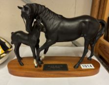 A Beswick black beauty & foal horse group