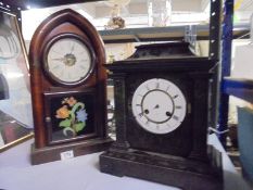 An American arched top clock and one other.