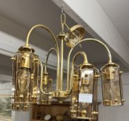 A glass 6 lantern chandelier