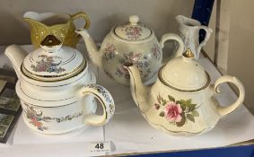 A quantity of teapots, jug and a Portmeirion Parisan jug