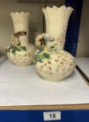 A pair of Staffordshire vases.
