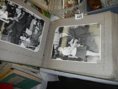 A large album of black and white photographs.