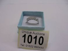 A 18ct gold and platinum six stone diamond ring, 1.5 carat, size N, 4 grams.