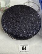 A decorative ladies evening bag with attached bangle holder