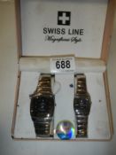 A boxed pair of lady's and gent's Swiss Line wrist watches (retail price £299).