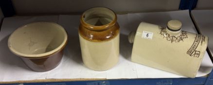 A stoneware Doulton foot warmer, storage jar and bowl