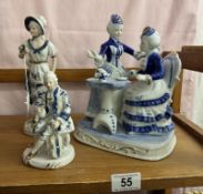 A quantity of blue and white vintage porcelain figures