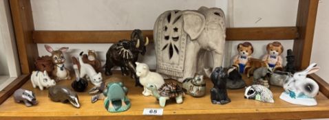 A quantity of mixed media animals including ceramic resin and Welsh slate