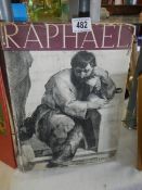An old art book 'Raphael' with full page images.