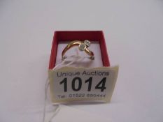 A 14ct yellow gold ring set two diamonds, 35pt. size U, 3.52 grams.