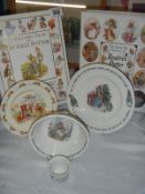 Two Beatrix Potter books and a Beatrix Potter breakfast set.