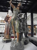 Two Victorian spelter figurss and and a ceramic monk, all a/f.