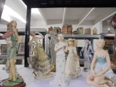 A selection of ceramic and resin figurine, some with art deco influences.