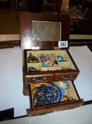 A jewellery box and mixed costume jewellery.