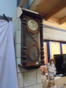 A Victorian mahogany wall clock.