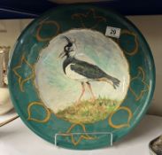 A large dish with bird design