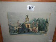 A framed and glazed watercolour village scene.