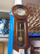 A small regulator wall clock.