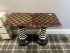 A pair of chess-themed tables